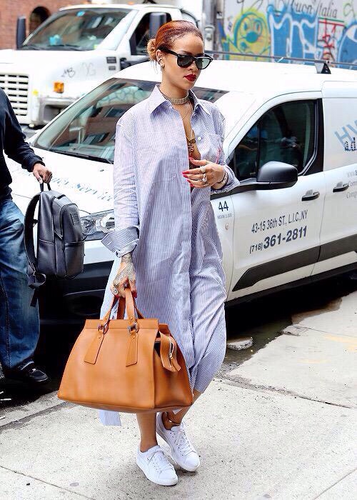 Rihanna was spied in the streets of NYC in a Céline maxi striped shirtdress, Puma sneakers,  and an Armani handbag.