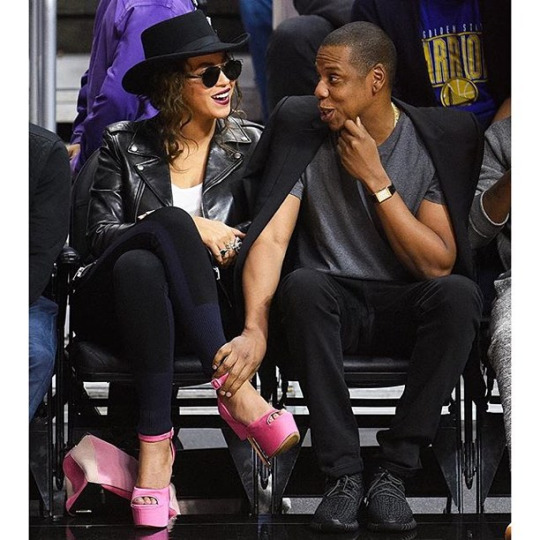 Beyonce's Warriors vs. Clippers Game Dior Sunglasses, Saint Laurent Biker Jacket, Rag & Bone Colorblock Leggings, Loewe Pink Puzzle Handbag, and Custom Givenchy Pink Platform Sandals