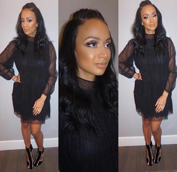 Bombshell Draya Michele glowed in a black sheer long sleeve dress and Tom Ford Sandals.