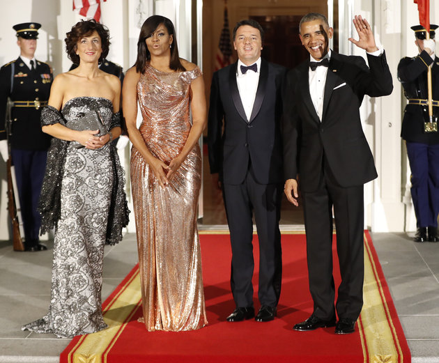 President Barack Obama and first lady Michelle Obama pose for a photo as they greet Italian Prime Minister Matteo Renzi and his wife Agnese Landini on the North Portico for a State Dinner at the White House in Washington, Tuesday, Oct. 18, 2016. (AP Photo/Pablo Martinez Monsivais)