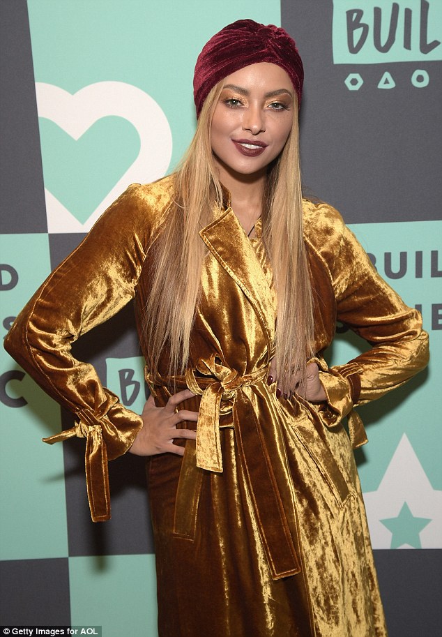 kat-graham-build-studio-opening-a-l-c-augusto-coat-2