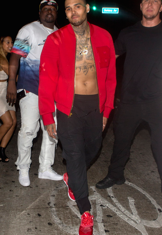 Men’s Fashion Flash: Chris Brown’s RNWND LA Red ‘B’ Varsity Jacket and Adidas Tubular Sneakers