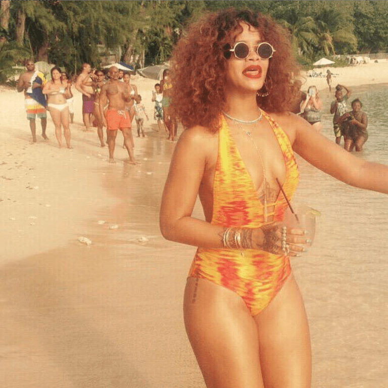 Rihanna Wears Gysea Swimwear Karijini Deep V Orange Reversible One Piece Swimsuit and Charlie by MZ’s Adriana Citrine Yellow Bikini for Barbados Vacation