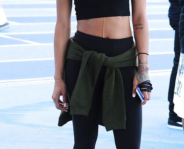 Splurge: Karrueche Tran’s Athletes vs. Cancer Charity Football Game L.A.M.B Payton Orange and Black Cage Sandals