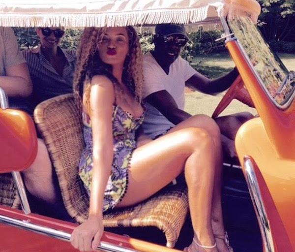 Steal: Beyonce’s Official Site ASOS Mirror V-Neckline Tropical Print Pom Pom Hem Romper