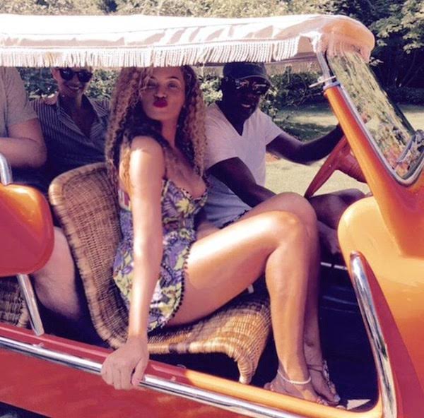 Steal: Beyonce’s Official Site ASOS Mirror V-Neckline Tropical Print Pom Pom Hem Romper