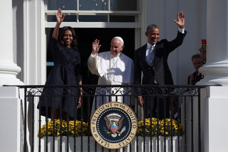 First Lady Michelle Obama Wears Monique L’huillier Fall 2015 Midnight Blue Guipure Lace and Textured Jacquard 3/4 Sleeve Dress To Welcome Pope Francis