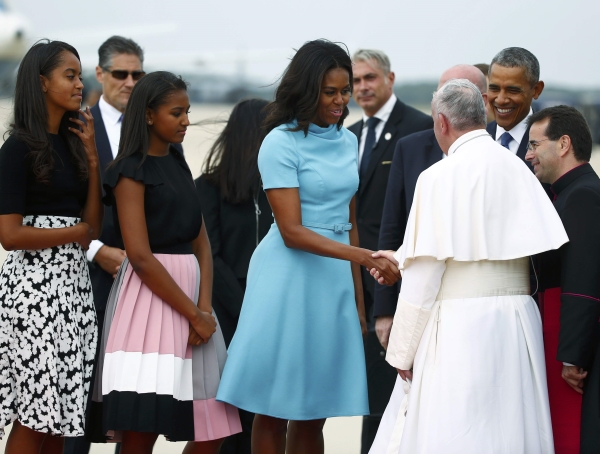 Wardrobe Query: First Lady Michelle Obama’s Washington D.C. Pope Visit Carolina Herrera Blue Cowl Neck Dress and Sasha Obama’s Kate Spade Colorblocked Pleated Pink, Gray, White, and Black Skirt