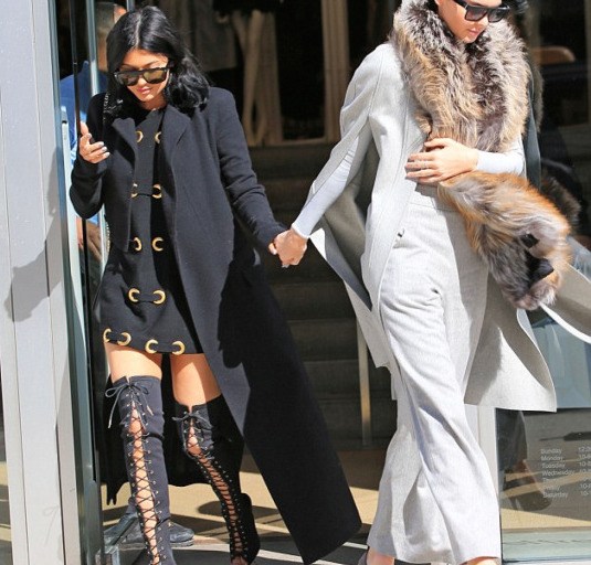Hot! or Hmm…: Kylie Jenner’s New York City Haider Ackermann Black Wool Coat, Gold Accented Vintage Dress, and Tom Ford Thigh High Lace Up Boots