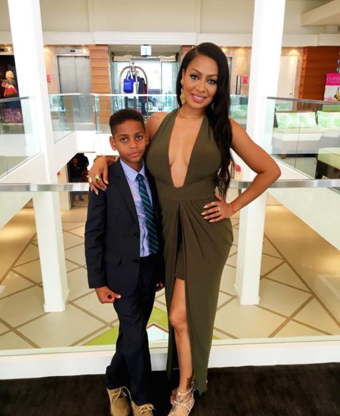 Splurge: Lala Anthony’s Father’s Wedding House of CB Olive Green Crista Long Halter Maxi Dress