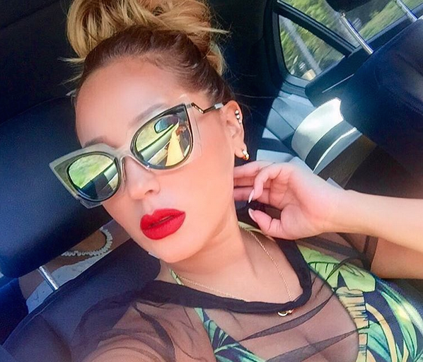 Splurge: Adrienne Bailon’s Instagram Andrea Iyamah Leaf Print Nivada High Waist Swimsuit and Fendi Cat Eye Green Mirrored Sunglasses