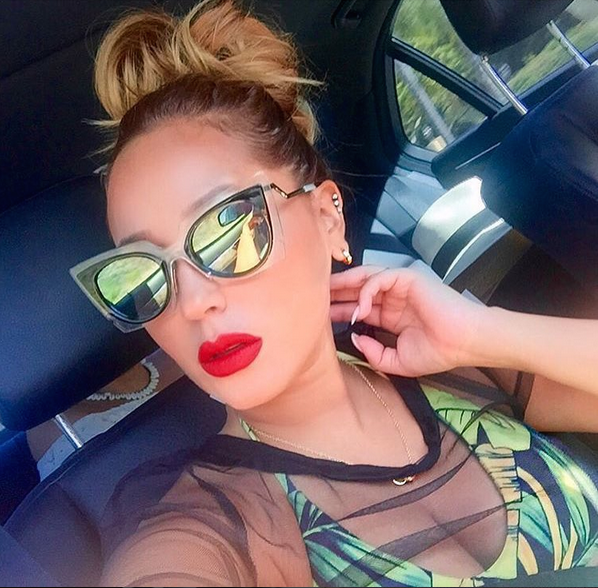 Splurge: Adrienne Bailon’s Instagram Andrea Iyamah Leaf Print Nivada High Waist Swimsuit and Fendi Cat Eye Green Mirrored Sunglasses