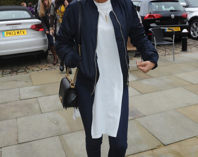 Steal: Leigh-Anne Pinnock’s Key 103 Radio Station Topshop MA1 Bomber Jacket, White Side Split High Neck Tunic, and Moto Vintage Rinse Leigh Jeans