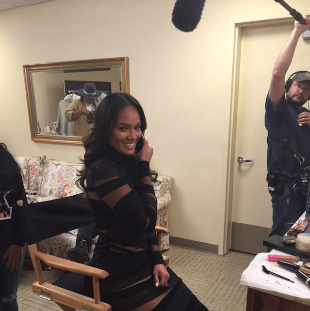 Wardrobe Query: Evelyn Lozada’s Twitter Livin Lozada Filming Emilio Pucci Black Banded Wool and Mesh Dress