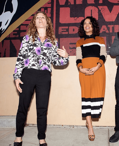 Hot! or Hmm….: Tessa Thompson’s Creed San Francisco Mural Unveiling Michael Kors Resort 2016 Caramel Intarsia Top and Caramel, Black, and White Pleated Skirt