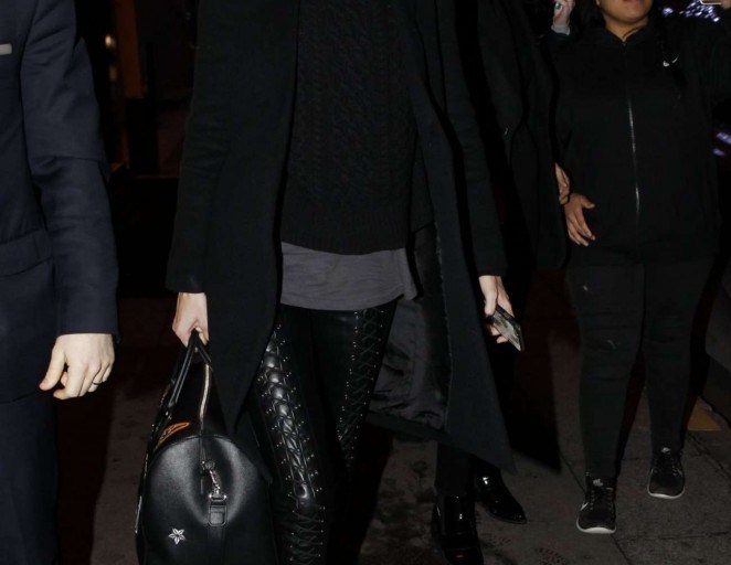 Splurge: Gigi Hadid’s Paris Charlotte Simone Black Sass Cap, ThePerfext Black Manhattan Coat, and Karl Lagerfeld Black Weekender Bag