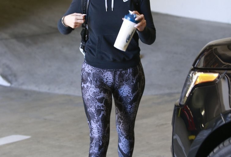 Splurge: Khloe Kardashian’s Beverly Hills HPE Snake X Leggings and Givenchy Plane Print Backpack