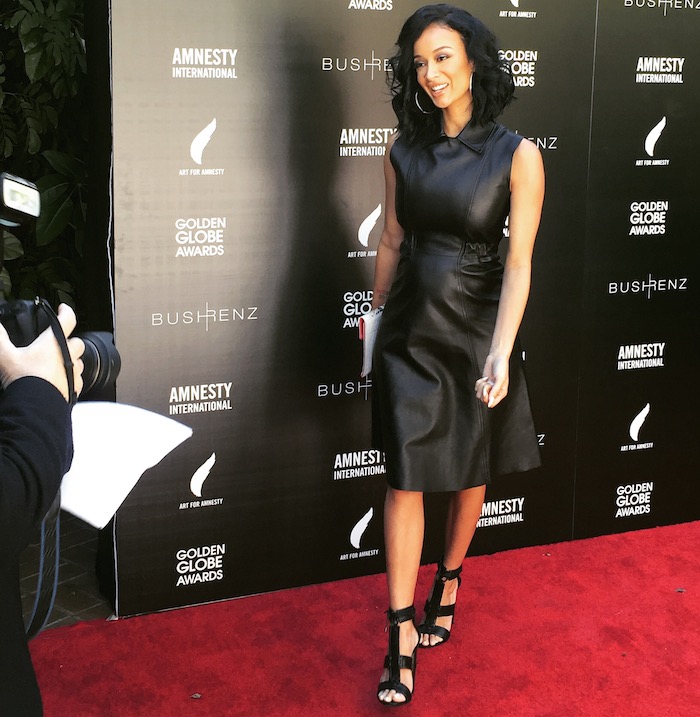 Splurge: Draya Michele’s Art For Amnesty Pre-Golden Globes Recognition Brunch  Acne Studios Levice Black Leather Dress and Tom Ford Patchwork Sandals
