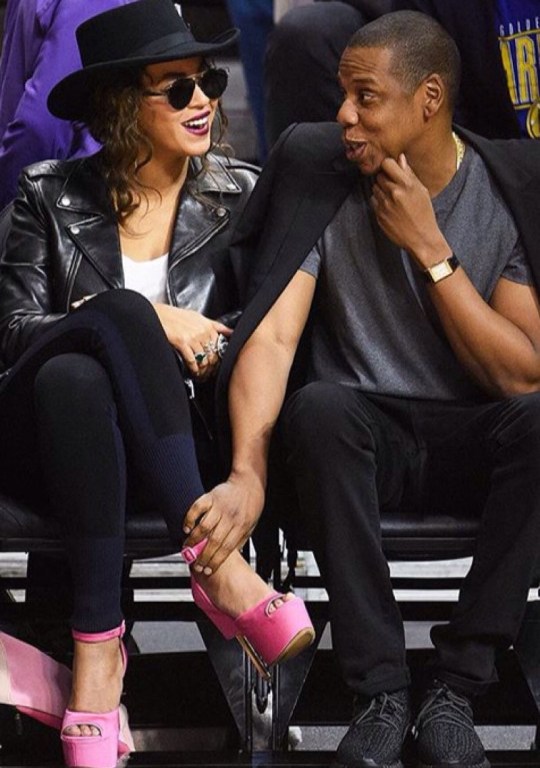 Get The Look: Beyonce’s Warriors vs. Clippers Game Dior Sunglasses, Saint Laurent Biker Jacket, Rag & Bone Kristin Colorblock Leggings, Loewe Pink Puzzle Handbag, and Custom Givenchy Pink Platform Sandals