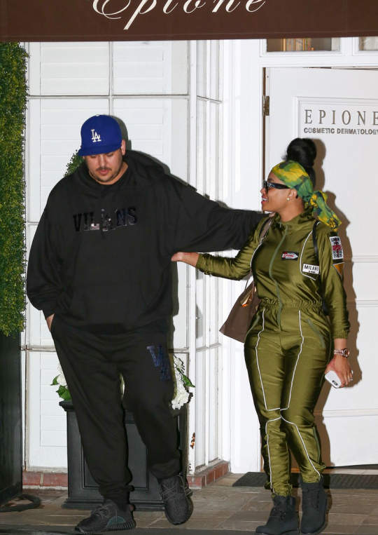 Splurge: Blac Chyna’s LA Milano di Rouge Olive Green Venus Mars Jumpsuit + Rob Kardashian’s Villans Black Hoodie Sweatshirt