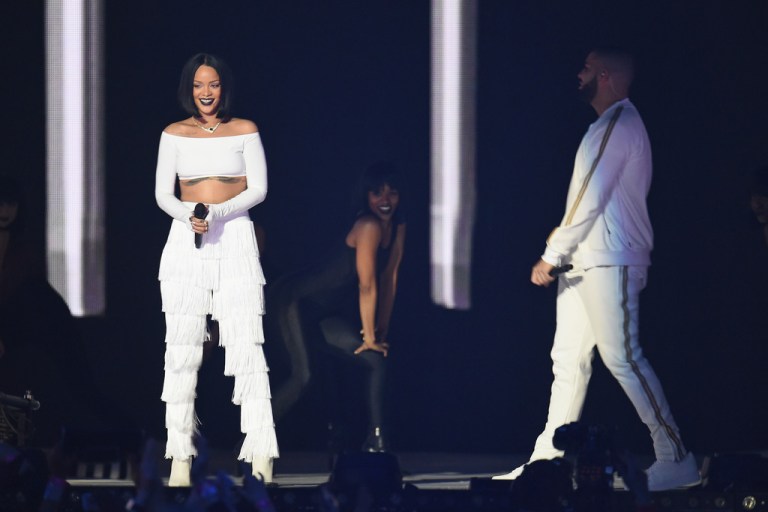 Splurge: Rihanna’s 2016 BRIT Awards Performance Norma Kamali White Fringe Pants + Video of Her Performance of “Consideration” with SZA and “Work” with Drake