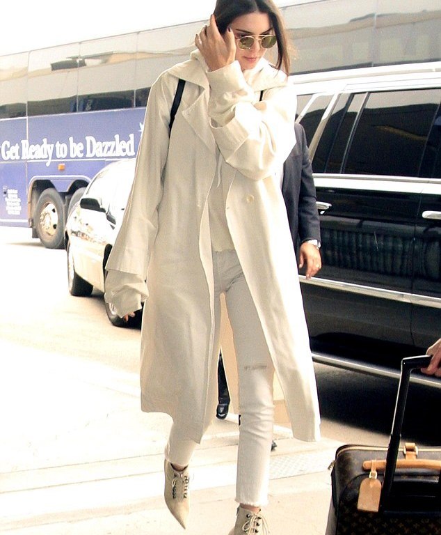 Splurge: Kendall Jenner’s LAX Airport Unravel Oversized Cashmere Hoodie, Raquel Allegra Military Trench Coat, and Balenciaga Studded Side-zip Ankle Booties