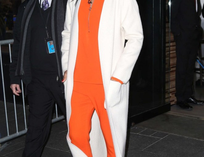 Splurge: Kelly Rowland’s Good Morning America Stella McCartney Orange Arlesa Top, Orange Trousers, and Christian Louboutin Multicolor So Kate Python Pumps