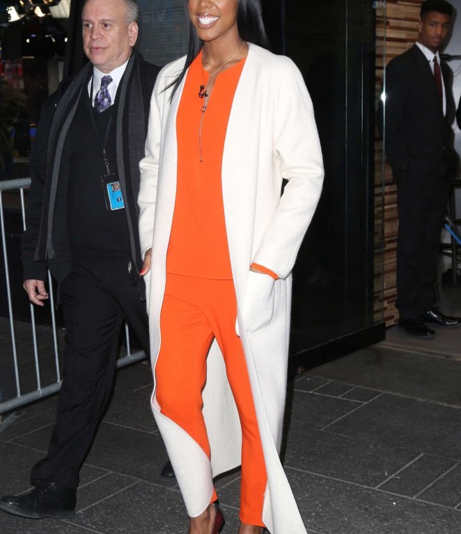 Splurge: Kelly Rowland’s Good Morning America Stella McCartney Orange Arlesa Top, Orange Trousers, and Christian Louboutin Multicolor So Kate Python Pumps