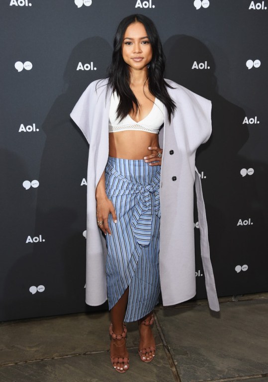 Get the Look: Karrueche Tran’s AOL Upfront New York City Topshop White Mesh Trim Bra, Striped Knot Skirt, and Azzedine Alaia Sandals