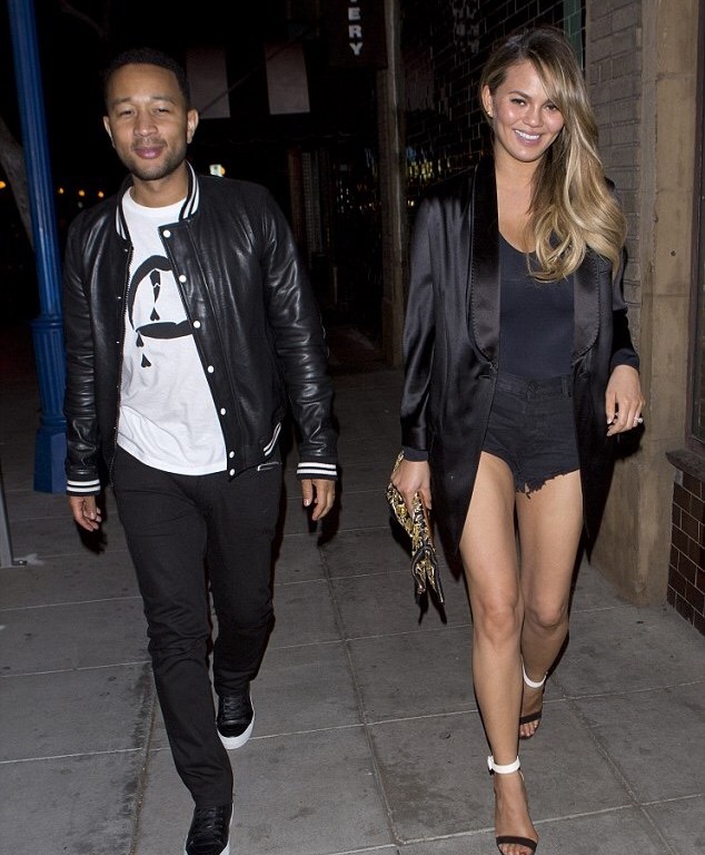 Splurge: Chrissy Teigen’s Jones Bar & Restaurant Givenchy Deconstructed Black Tuxedo Jacket and Gianvito Rossi ‘Portofino’ Black and White Ankle-Strap Sandals and John Legend’s Saint Laurent Gaberdine and Leather Teddy Jacket and Vampire Printed Tee
