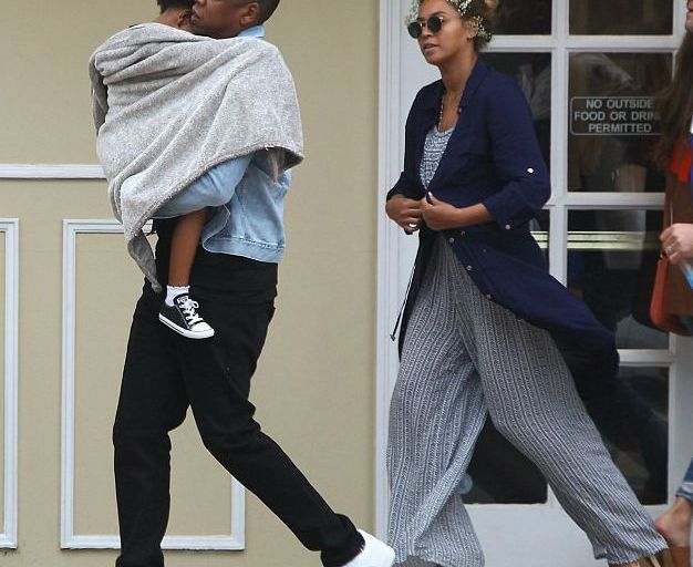Splurge: Beyoncé’s East Hampton Melissa Odabash Paige Navy Challis Shirt Dress, Mara Hoffman Pinwheel Ruffle Off the Shoulder Crop Top, and Wide Leg Pants