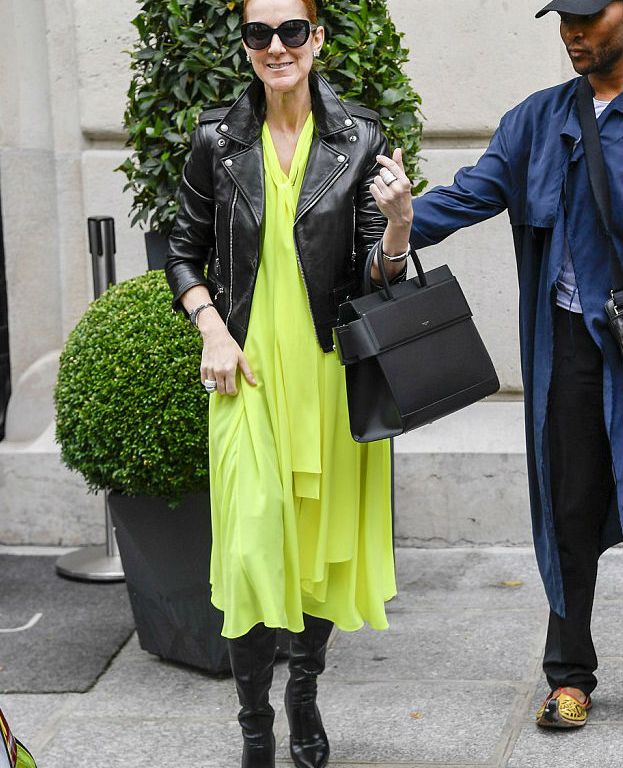 Splurge: Celine Dion’s Royal Monceau Hotel Balenciaga Neon Yellow Scarf Neck Crepe de Chine Dress and Givenchy Black Leather Horizon Satchel