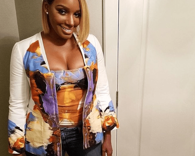 Wardrobe Query: Nene Leakes’s Instagram Ralph Rucci Resort 2014 Rorschach Printed Purple and Yellow Top and Cardigan