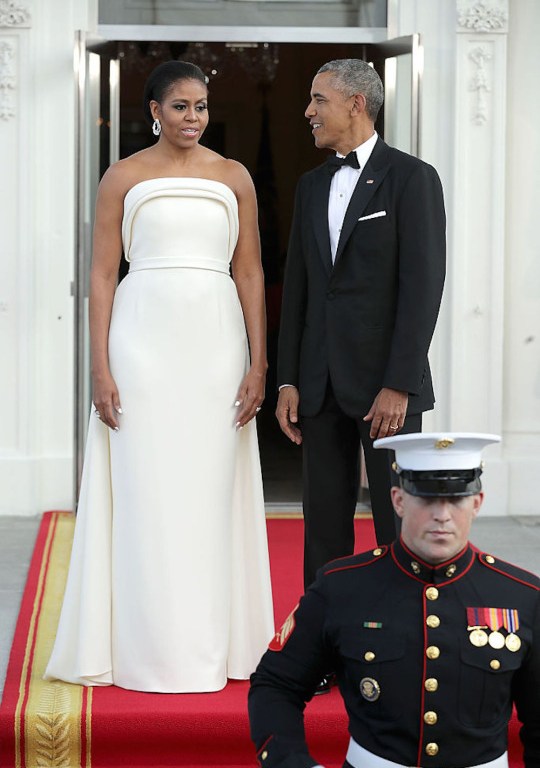 First Lady Michelle Obama wears a Custom Brandon Maxwell Strapless Ivory Sponge Crepe Gown to the White House State Dinner