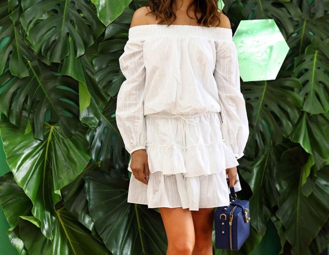 Splurge: Jamie Chung’s Skinceuticals Event Elizabeth and James White Kenji Off the Shoulder Blouson Dress, Dolce & Gabbana Blue Rosaria Tote, and Blue Bianca Crystal Embellished Lace Slides