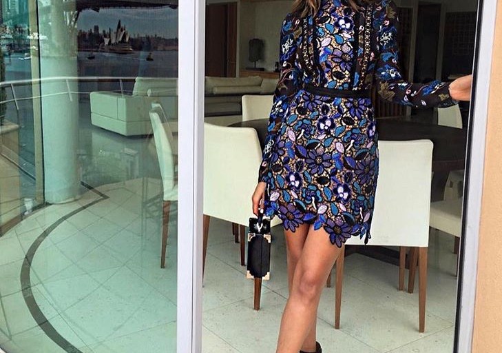 Splurge: Olivia Culpo’s <em>Morning Show on 7</em> Victoria, Victoria Beckham Floral Applique Tailored Black Coat, Self Portrait Guipere Lace Multicolor Floral Mini Dress, Aquatalia ‘Rochelle’ Black Ankle Boot, and Aspinal of London Black Mini Trunk Bag