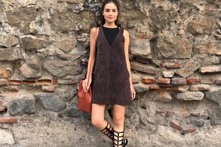 Look for Less: Olivia Culpo’s Instagram Free People Chocolate Retro Love Suede Dress, Stuart Weitzman Gladiator Sandals, and Mansur Gavriel Cammello Large Bucket Bag