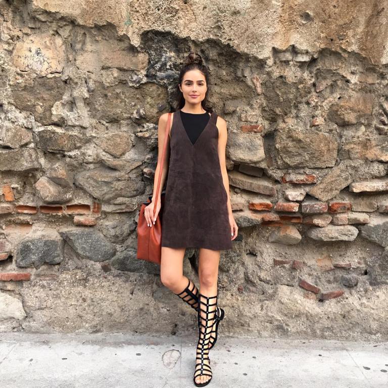 Look for Less: Olivia Culpo’s Instagram Free People Chocolate Retro Love Suede Dress, Stuart Weitzman Gladiator Sandals, and Mansur Gavriel Cammello Large Bucket Bag