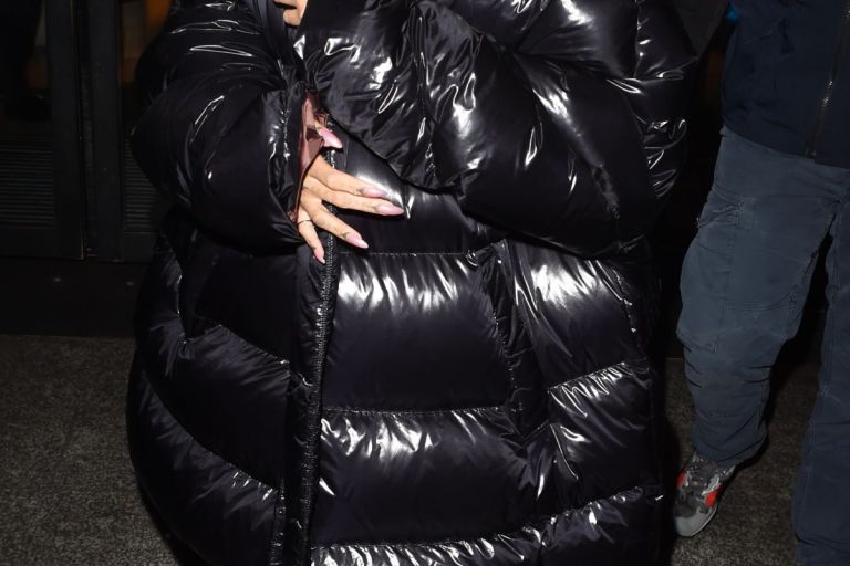 Splurge: Rihanna’s Harrod’s Raf Simons Black Down Oversized Coat and Fenty x Puma Fall 2016 Heeled Booties