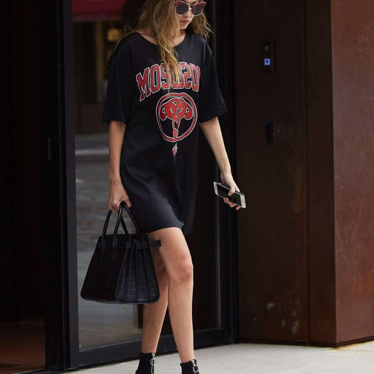 Splurge: Gigi Hadid’s New York City Moschino Black Double Question Mark Dress and Versace Black Zip Up Ankle Booties