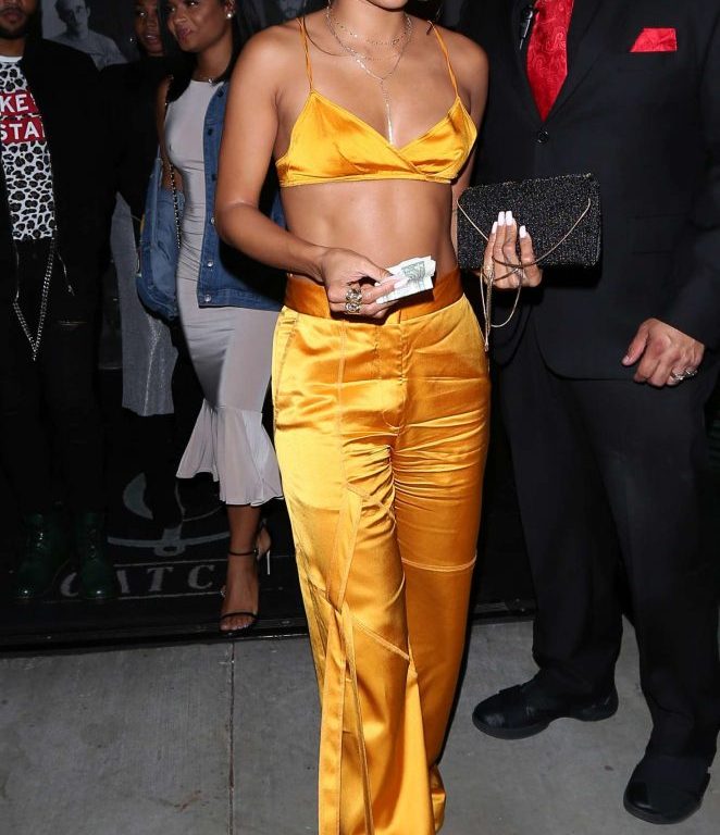 Splurge: Karrueche Tran’s Catch Manning Cartell Resort 2017 Saffron Bralette and $360 Flared Tie Detail Trousers
