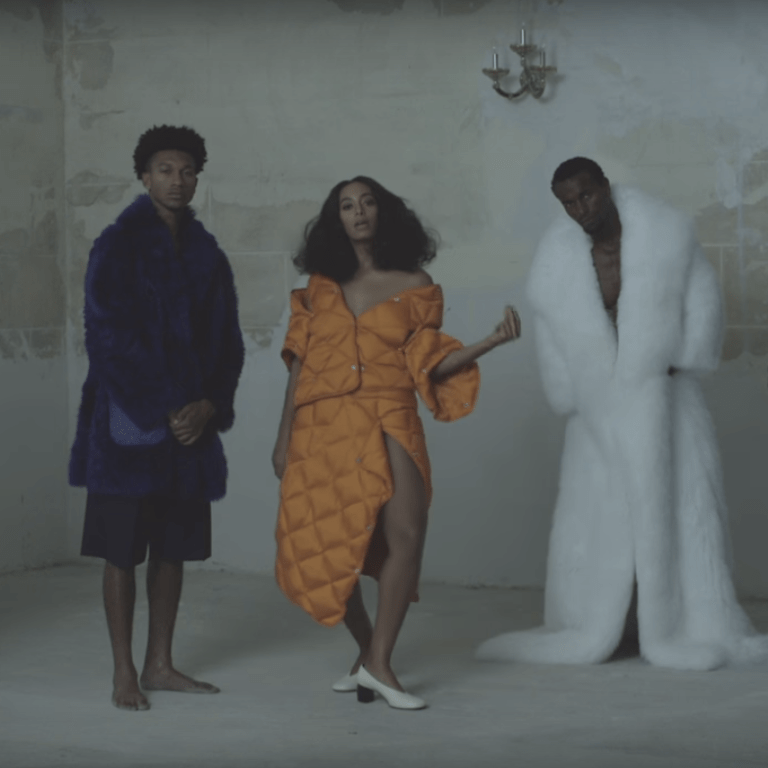 Splurge: Solange Knowles’s “Cranes In The Sky” Music Video $1,150 Acne Studios Baltimore Down Orange Coat