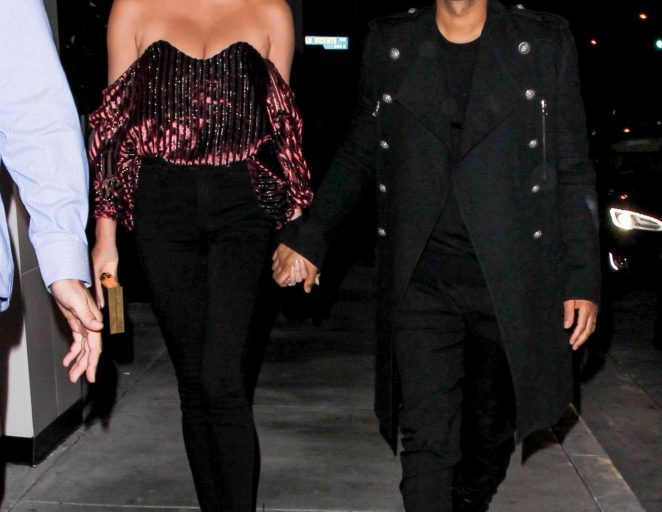 Splurge: Chrissy Teigen’s Catch $445 Caroline Constas Gabrielle Velvet Bustier and $850 Aquazzura Black Cayenne Sandals