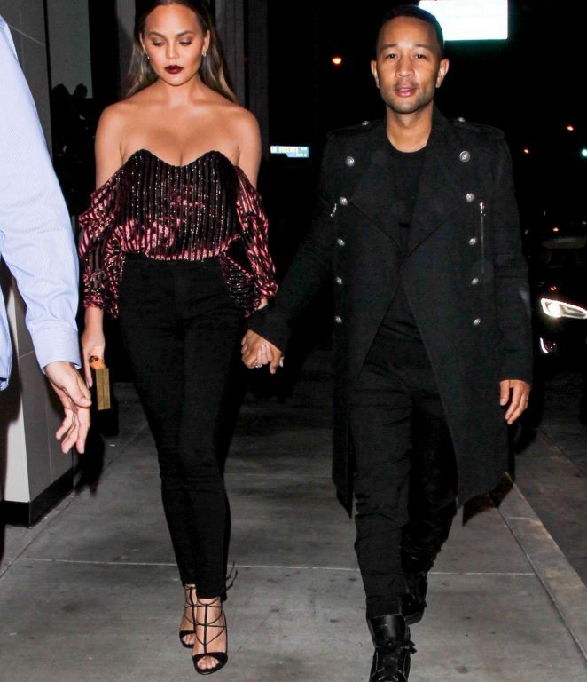 Splurge: Chrissy Teigen’s Catch $445 Caroline Constas Gabrielle Velvet Bustier and $850 Aquazzura Black Cayenne Sandals