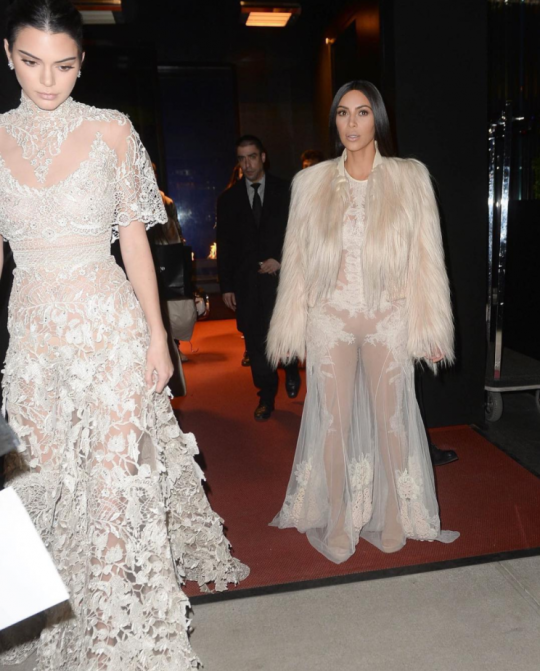 Kim Kardashian Wears Givenchy Fall 2010 Couture Sheer Gown and Fur Coat, Kendall Jenner Wears Elie Saab Spring 2016 Couture, and Kylie Jenner Wears Vetements Camo Coat for Shoot on Ocean’s Eight