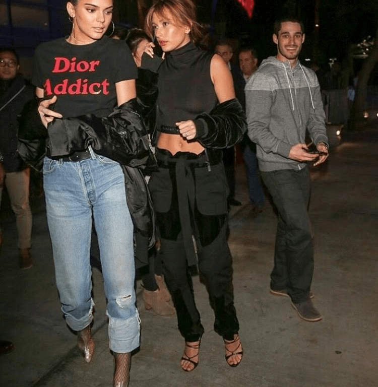 Splurge: Hailey Baldwin’s LA Lakers Game Marcelo Burlon County of Milan ‘Torrismo’ Velvet Bomber Jacket and Matching Velvet ‘Mocha’ Trousers