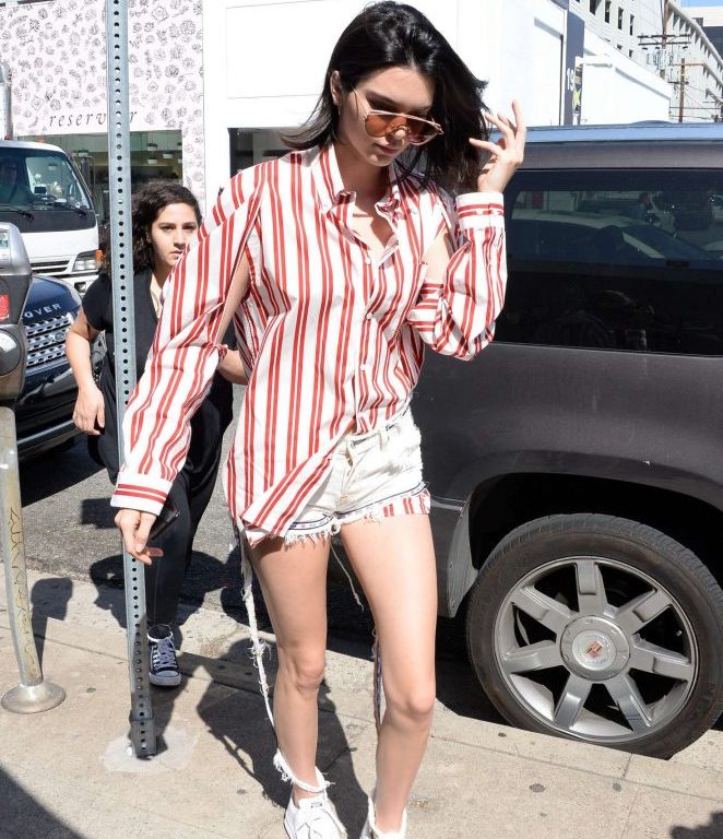 Splurge: Kendall Jenner’s Cuvee $723 Balenciaga White and Red Stripe Open Sleeve Button Front Shirt and $400 Adidas by Raf Simons White Stan Smith Sneakers