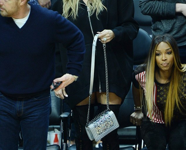 Splurge: Khloe Kardashian’s Cavaliers vs Clippers Game Givenchy Logo Neoprene Hoodie, Gianvito Rossi Thigh High Boots and Chanel Small Boy Bag