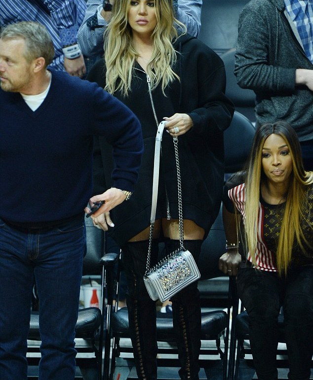 Splurge: Khloe Kardashian’s Cavaliers vs Clippers Game Givenchy Logo Neoprene Hoodie, Gianvito Rossi Thigh High Boots and Chanel Small Boy Bag