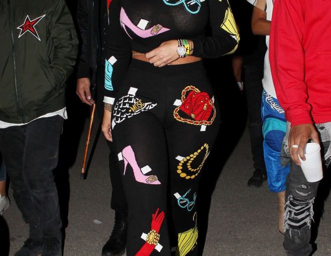 Splurge: Amber Rose’s Coachella 2017 Neon Carnival Moschino $595 Black Graphic Knit Cropped Sweater and $875 Graphic Jersey Flare Pants